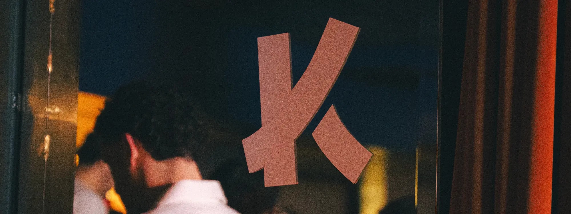 The Kaizer K on a glass panel at a Kaizer Fitness Club night
